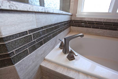 Bathtub with New Fixtures and Surround Tile in Indianapolis